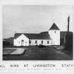 Copy of historic photograph showing general view.
