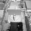 General view of fan house from West on top of No. 2 winding tower.  The fanhouse contains two identical fans (one in use, one on standby), made by Mather and Platt of Manchester.  Each fan provides 212.4 cubic metres of air per second at 2490 N/sqm.  In cold conditions, the air can be heated using oil-fired heaters.