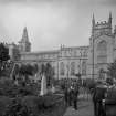 View of Dunfermline Abbey with figures and camera.