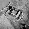 Oblique aerial view centred on castle from SW.