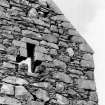 View of exterior of window in upper part of W gable.