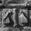 Detail of carved panel set in base of sundial, Doocot Park, Crail