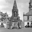 Fife, Falkland. General view from east of Bruce Fountain, with Falkland Palace in the background.