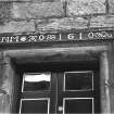 Detail of lintel inscribed 'NM AO 1610' above door of Moncrief House, High Street, Falkland