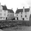 General view of facing wall of old basin with stone pawl, also shows Gyles.