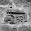 Easter Bendochy.
General view of fragment built into East end of South wall of farmsteading. Animal head and square decoration.
