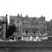 Scanned image of general view of facade from opposite side of the river Ness.