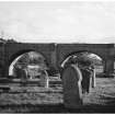 View of arches with gravestones in foreground