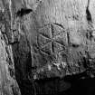 Carved stone (1), Eilean Mor. Incised hexafoil.