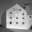 Lagavulin Distillery, Old Malt Barn.
View from West, showing plaque reading 'Lagavulin Distillery, White Horse Distillers Ltd. Est. 1742'