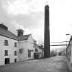 Laphroaig Distillery.
View of malt-barn, kiln and chimney.