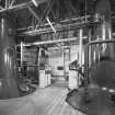 Bruichladdich Distillery, Islay.
View of still house, riveted wash-still (left), low wines still (right).