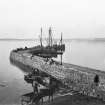 Bowmore Distillery, Bowmore, Islay.
View of ship-to-shore delivery of coal to jetty by means of a small boat and cartage.