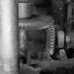 Redhouses Woolen Mill, Islay.
View of piecing machine, detail of level-gears (carder end) for transmitting shaft-drive to gear train at far end (location C on drawings).