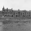 Hawick, 16-19 Mansfield Road
View across river to terraced houses and public house