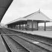 View of Aviemore Railway Station from SSW showing iron-framed shelter.