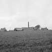 Balblair, Kirkton Farm
General view of buildings from E, showing steam-engine chimney stack.