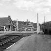 Rogart Mills and Rogart, Station
View from W showing level crossing, signal box and S building of mills