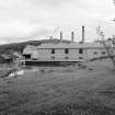 Dufftown, Glenfiddich Distillery
View from SSW showing central buildings, dam and still house number two