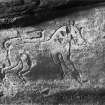 Carving of animal with tail curling over back in Jonathan’s Cave, East Wemyss.
Photographed by John Patrick in 1902. 
