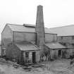 Stromness, North End, Stromness Harbour
View from NW showing chimney, WNW front and NNE front of retort house