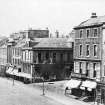 View of corner of Princes Street and South St Andrew Street from south east showing the building previous to the Richmond Hotel which was demolished to make way for R W Forsyth, also showing street gas lamps and 25 Princes Street, the North British Hotel.