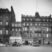 View of 109 - 111 Princes Street, Edinburgh, from south, with Lotus & Delta Shoes, John Taylor & Son, Willerby's, Timpson and Mackies.