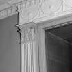 Ground floor, South East apartment, detail of pilasters and frieze on West wall