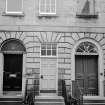 Contrast of D fanlight on common stair with A type on adjoining house (Plate glass evidently substituted in no.55)