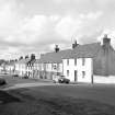 Islay, Bowmore, Main Street
General view from SSE showing ESE front of cottages on NE side of Main Street