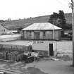 Lairg, Station
View from WNW showing NW front of goods shed with hut in foreground