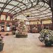 Coloured postcard view of interior of Wemyss Bay station.