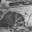 Calderhead Colliery and Easter Baton, oblique aerial view, taken from the SSE, showing the three bings of Calderhead Colliery coal mine in the bottom half of the photograph, and Easter Baton open-cast mine at the top edge.