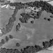 Myres Castle, oblique aerial view, taken from the SW, centred on the cropmarks of a fort. Myres Castle and Walled Garden are visible in the top centre of the photograph.