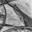 Carmuirs, oblique aerial view, taken from the NE, centred on the cropmarks of Roman Temporary Camps 'D' and 'E'.