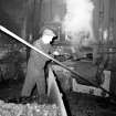 Muirkirk, Gasworks, Interior
View showing man shovelling coke into retort in retort house