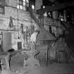 Glengarnock Steel Works, Smithy; Interior
View of smith working at fires