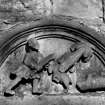 Carving from Dean Mansion "Man armed with thick pole with a hook at the end, or goat running towards him, bear seizes the goat by the waist another bear is lying dean on the ground"