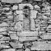 Oronsay Priory.
Detail of window with decorated arched head in South side wall of priory.