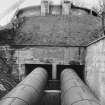 Album photograph showing view of surge tank and pipeline, Bonnington hydroelectric power station. 