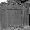 View of headstone for James Thomas, 1750: soul with volutes either side at top, panel with border.