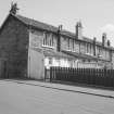 Hallside Steelworks, 1-28 Village Road, Terraced Houses
View from NNW showing WNW front of numbers 11-16 and NNE front of number 11