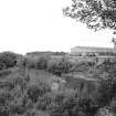 Gartcosh Steelworks
View from SW showing wall with NW building of steelworks in background