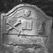 Reverse face of undated gravestone; winged cherub over open book bearing the legend 'VERBUM DOMINIS MANET IN AETERNUM', crossbones, and skull surmounted by an hourglass.