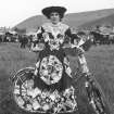 Woman and bicycle decorated with postcards in Innerleithen 1903. 
