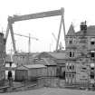 Greenock, Belhaven Street, Glen Shipyard
View from S showing part of SSW front of number 12 Highholm Street with cranes of Glen Yard in background