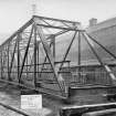 Ex-Scotland. Road and light Railway Bridge, unspecified, Nepal
View of 105 feet span by 11 feet 7 1/2 inch clear width roadway - assembled outside erecting shop at Dalmarnock Iron Works
