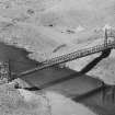 Ex-Scotland. Road Bridge, Tsoelike Suspension Bridge, Lesotho, Africa
Aerial view of completed bridge
Insc verso: 'Tsoelike Suspension Bridge, Basutoland'
Dated verso: 'May 1930'.