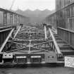 Ex-Scotland. Road Bridge, Tsoelike Suspension Bridge, Lesotho, Africa
View of bridge at Arrol's works, Glasgow
Titled: 'Crown Agents for the Colonies Basutoland Req[uisition] No. 935', '210' 0" Suspension Bridge towers', 'Contractors Sir William Arrol and Co. Ltd.', 'Nov[ember] 1929'.
Insc verso: 'Tsoelike Suspension Bridge, Basutoland'