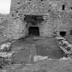 Bonawe, Iron Works, Furnace
Excavation photograph; view of casting house and W tuyere arch, from W